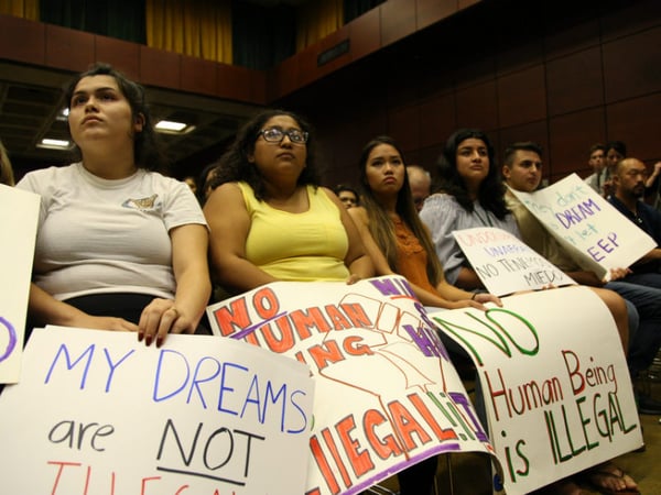 Some in attendance brought signs in support of dreamers and other immigrants at Sacramento State University on Monday, Sept. 18, 2017. 